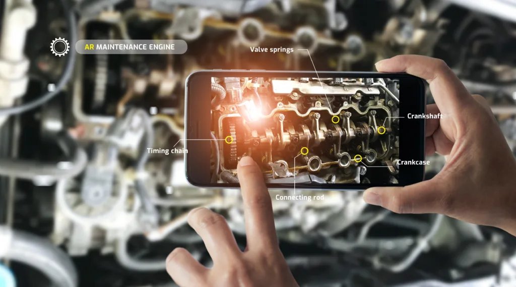 Person using mobile technology to display an engine details through Augmented Reality